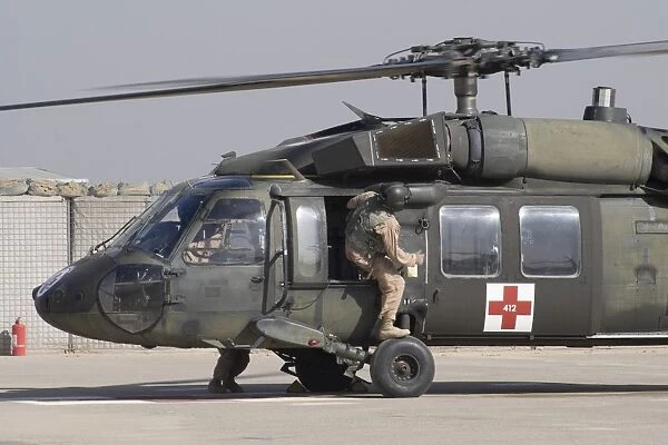 A UH-60 Blackhawk Medivac helicopter refuels at Camp Warhorse after a mission