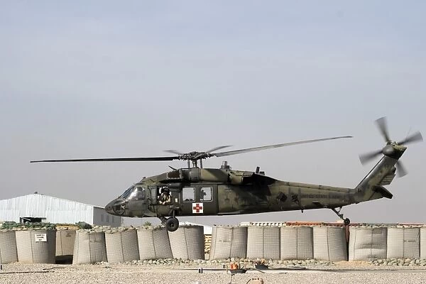 A UH-60 Blackhawk prepares to land at Camp Warhorse to refuel