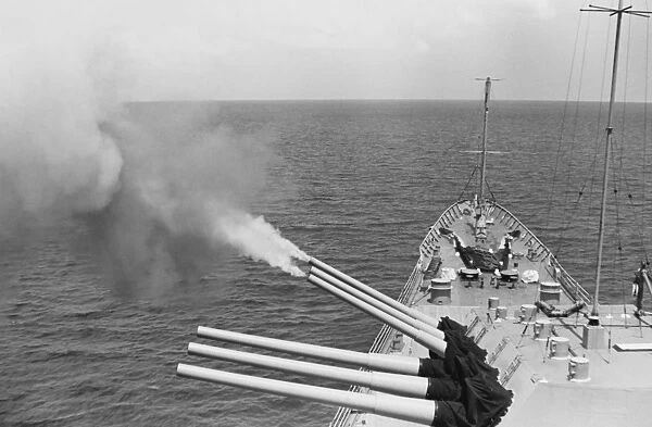 USS Bostons triple gun turret fires on North Vietnamese targets, Operation Sea Dragon