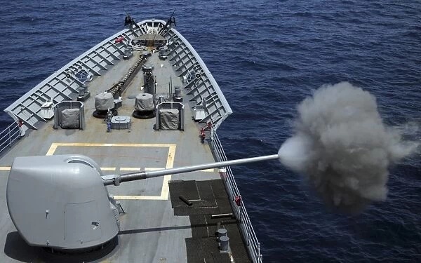 USS Philippine Sea fires its MK 45 5-inch lightweight gun