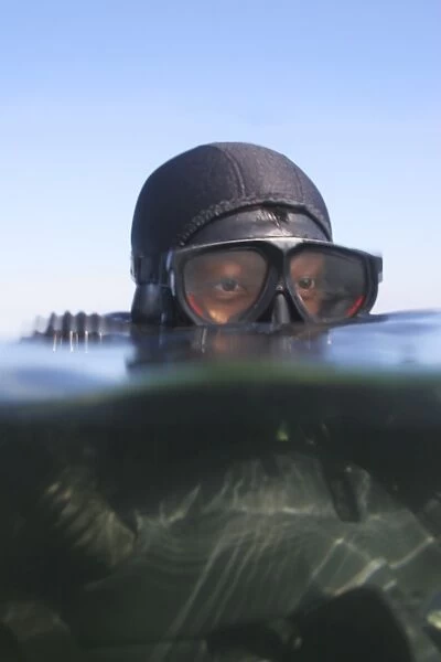 An over under view of a Navy SEAL combat swimmer