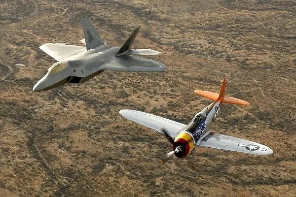 A World War II-era P-47 Thunderbolt and an F-22A Raptor fly in formation
