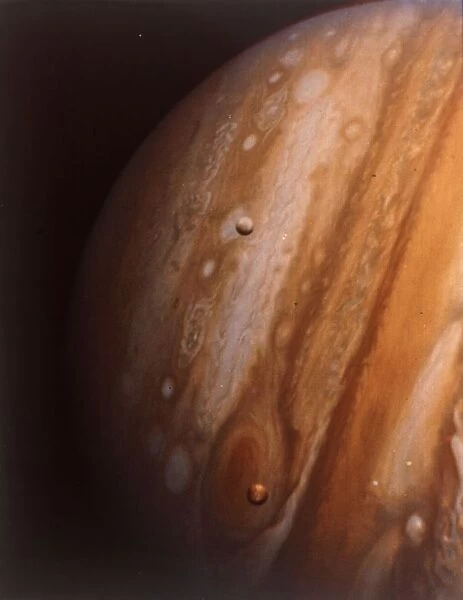 Jupiter, Io and Europa from 20 million kilometres. Creator: NASA