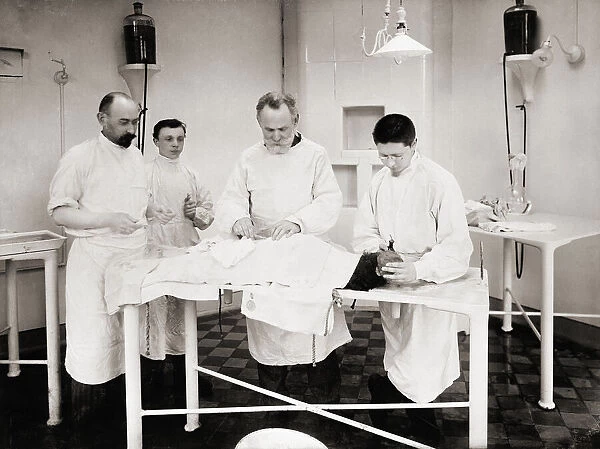 Dr Ivan Pavlov (third from left) operating on a dog in the Physiology Department, Imperial Institute of Experimental Medicine, St Petersburg, Russia circa 1902. Ivan Petrovich Pavlov, 1849 -1936. Nobel Prize winning Russian physiologist known for his work in classical conditioning