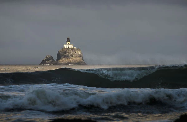 Early Sunlight Illuminates The Old Tillamook Rock Lighthouse; Cannon Beach, Oregon, United States Of America