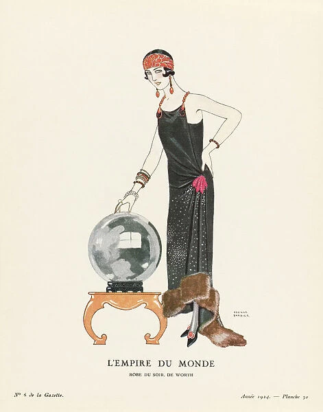 EDITORIAL L Empire du Monde. The Empire of the World. Robe du Soir, de Worth. Evening dress by Worth. Art-deco fashion illustration by French artist George Barbier, 1882-1932. The work was created for the Gazette du Bon Ton, a Parisian fashion magazine published between 1912-1915 and 1919-1925