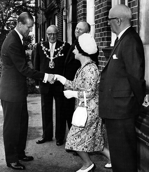 Prince Philip, Duke of Edinburgh shakes hands with the Mayoress of Leigh on his arrival