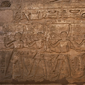 Children of Ramses II carrying flowers and ostrich feathers