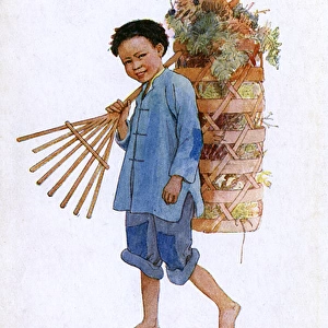 Chinese country boy with rake and laden backpack