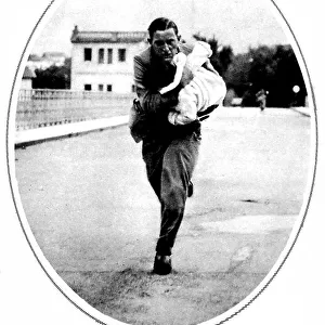 Journalist saving a child in Irun; Spanish Civil War, 1936