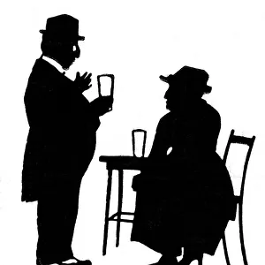 Man and woman drinking beer in a pub