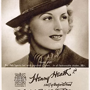 Woman wearing felt homburg hat. Date: 1940