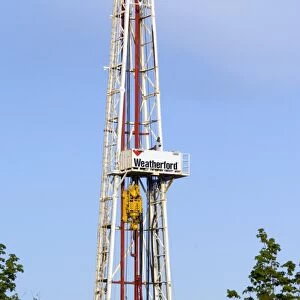 An oil-rig drilling derrick