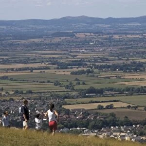 Family walking on Cleeve Hill, above Bishops Cleeve village, The Cotswolds