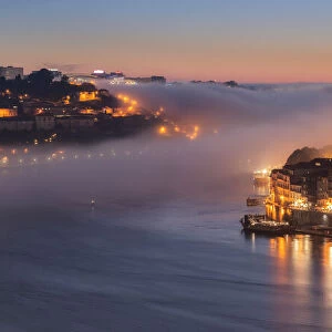 Porto at sunset with the sea fog rolling in, Porto, Portugal, Europe