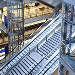 Staircase and escalators leading to the platform in modern train station