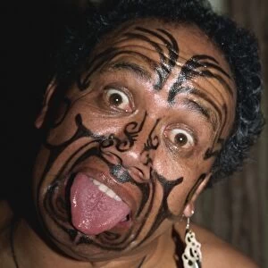 Traditional Maori war paint and tongue out