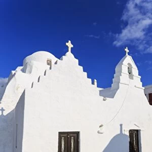 Whitewashed Panagia Paraportiani, Mykonos most famous church, under a blue sky, Mykonos Town