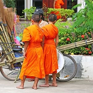 Buddhist Monks buying brushes, Vientiane, Laos
