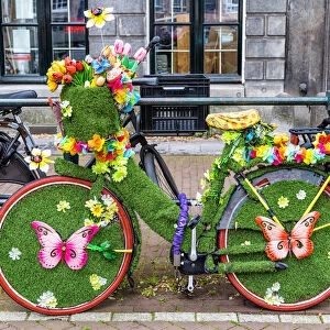 A bicycle decorated with butterflies and flowers in Amsterdam, the Netherlands