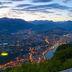 Elevated view over Lugano from Monte San Salvatore illuminated at Dusk, Lake Lugano