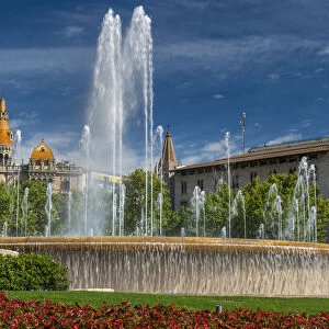 Fountain in Plaza Catalunya with Casa Rocamora modernist building behind, Barcelona