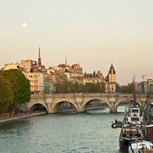 Paris, France. Locals enjoy a spring evening by the river Seine
