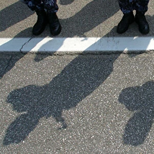 Romanian gendarmes cast shadows during a swearing-in ceremony in Bucharest