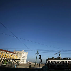 A tram passes Trade Square in the old city in Lisbon