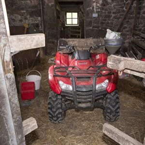 Honda quadbike inside farm barn, Chipping, Lancashire, England, August