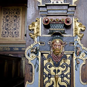 Denmark, Helsingoer. Kronborg Castle (aka Kronborg Slot). Ornate carved wooden chruch pew
