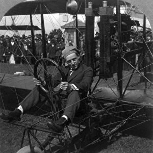 ART SMITH (1894-1926). American aviator, stunt pilot and pioneer of skywriting at night. Photographed seated in the cockpit of his biplane on the aviation field at the Panama-Pacific International Exposition, San Francisco, California. Stereograph, 24 June 1915