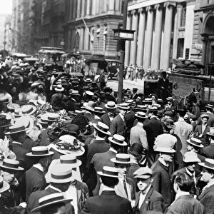 NEW YORK: CROWDED STREET. Crowds gathered outside Trinity Church at the intersection of Broadway