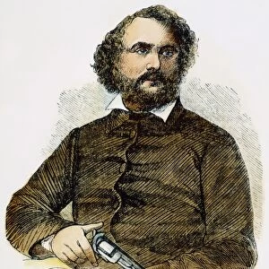 SAMUEL COLT (1814-1862). American inventor; with a gun: wood engraving, 1856