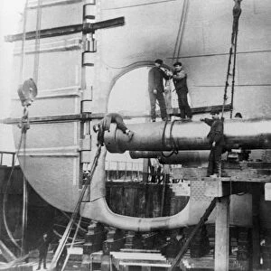 TITANIC: CONSTRUCTION, 1912. Workers assembling the propeller shafts of the RMS Titanic at Harland & Wolff shipyard in Belfast, Ireland. Photograph, c1912