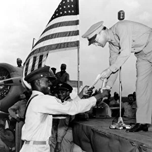 WORLD WAR II: AWARD, c1943. Man receiving a military award, Tuskegee Army Air Field, Alabama