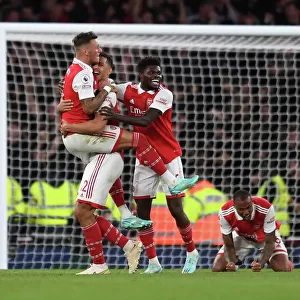 Arsenal's Triumph: Celebrating with White, Saliba, and Partey after Arsenal v Liverpool (2022-23)