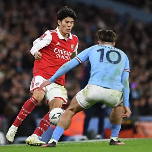 Clash at the Etihad: Tomiyasu vs. Grealish in the FA Cup Showdown (Manchester City vs. Arsenal, 2022-23)
