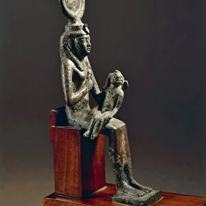 Statue representing Isis nursing Harpocrates or child god Horus, depicted with his childish plait resting on a side of the head, bronze