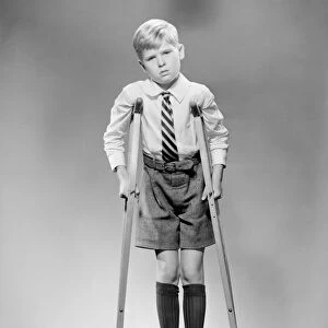 Boy on crutches, portrait