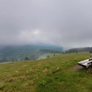 Lonely bench on Herzogenhorn mountain, clouds, southern Black Forest, Baden-Wuerttemberg, Germany, Europe
