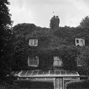 The front of a cottage in Sevenoaks covered in ivy. 1938