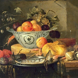 Still life with fruit, a blue and white porcelain bowl a herring on a pewter plate
