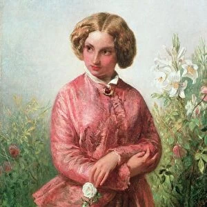Portrait of a young girl with a rose