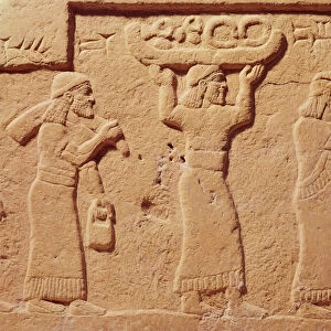 Relief depicting porters laden with gifts (stone)
