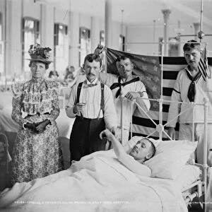 Taking a patients pulse, Brooklyn Navy Yard Hospital, c. 1890-1901 (b / w photo)