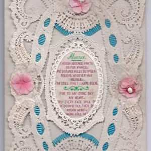 A Victorian embossed paper lace greeting card with a romantic verse embroidered on fabric