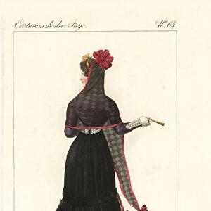 Woman of Madrid, Spain, 19th century. She wears a seethrough check mantilla veil with scarlet ribbons, black basquina dress and carries a fan. Handcoloured copperplate engraving by Georges Jacques Gatine after an illustration by Louis Marie Lante