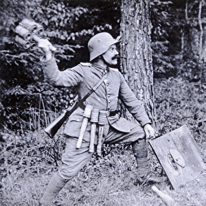 WWI German stormtroop officer demonstrating the use of cluster grenades against tanks