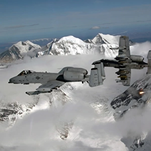 A-10 Thunderbolt IIs fly over mountainous landscape